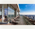 Spacious 1 bedroom with high ceilings. Washer/dryer in unit - Glass enclosed roof-deck